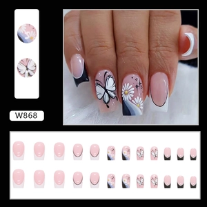 French butterfly press-on nails in black and white style with floral daisy patterns