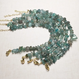 Five strands of natural crystal chip bead bracelets with golden lobster clasps and chains