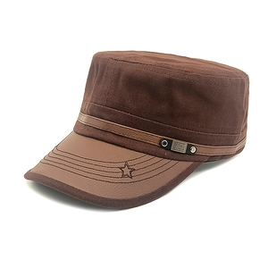 Close-up of brown military cap featuring leather brim and star embroidery detail