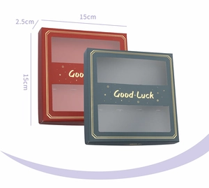 Gift box for coffee spoons with Good Luck gold lettering and a clear display window
