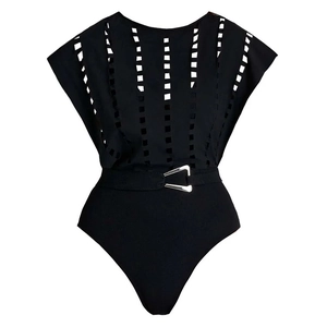 Detail of black one-piece swimsuit featuring vertical cut-outs and silver triangle buckle