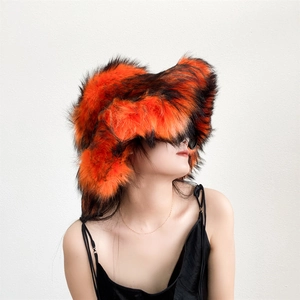 Detail of fluffy orange and black faux fur hat with thick punk style texture