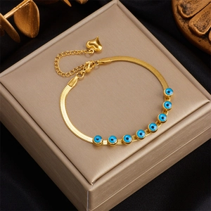 18k gold plated snake chain bracelet with blue evil eye beads and a heart charm