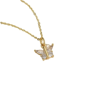 Golden butterfly pendant necklace featuring sparkling zircon crystals on a fine link chain