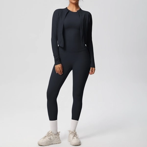 Detailed view of women's black 3-piece yoga set with zip-up jacket and high waist leggings