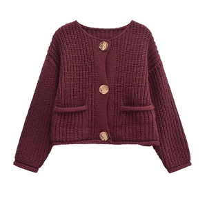 Burgundy chunky knit cardigan with gold buttons and double front pockets on white background