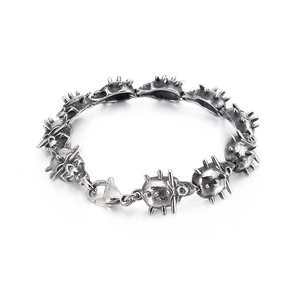 Men's punk stainless steel bracelet with skull charms and lobster clasp on white background