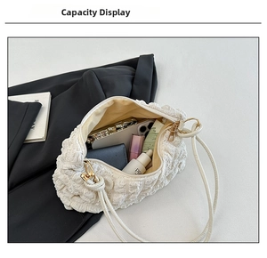 Close-up of a white textured bubble bag showing internal capacity for mobile and wallet