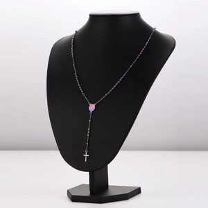 Rainbow rosary necklace with Virgin Mary medal and crucifix on black bust mannequin