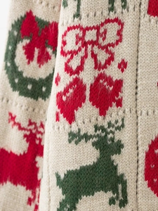 Gros plan sur la maille épaisse avec motifs de Noël jacquard d'élan et de nœuds