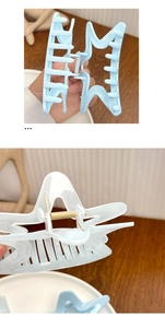 Detailed view of light blue starfish hair claw clip with sturdy metal spring mechanism