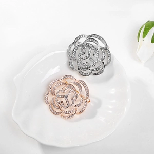 Elegant rose flower brooch pins in silver and rose gold with sparkling rhinestones