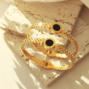 Luxury 18K gold plated titanium steel bangle with roman numerals and black enamel dial