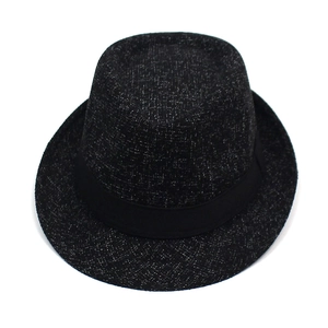 Detail of a grey heather fedora hat featuring a black ribbon band and textured wool blend fabric