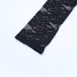 Close-up of black sheer mesh and floral lace detail on the sleeve of a dress