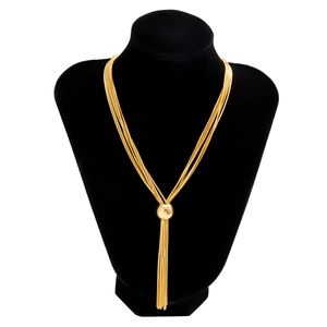 Detailed view of layered gold punk choker featuring a central round ball clasp and fringe chains