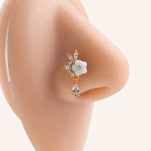 Golden 20G L-shaped titanium nose ring with flower design and teardrop crystal charm