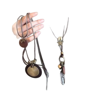 Bohemian wax rope necklace with wooden beads and vintage butterfly camera metal pendants