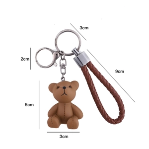 Detailed view of the 5cm resin bear pendant keychain with 9cm woven strap and metal clip