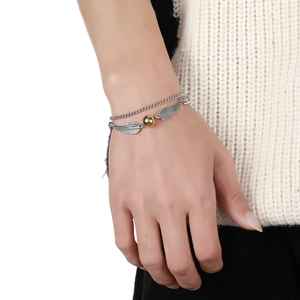 Double-layer stainless steel bracelet with silver angel wings and a central golden sphere