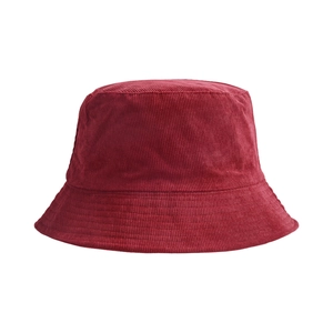 Macro detail of wine red corduroy fabric texture on a bucket sun protection hat