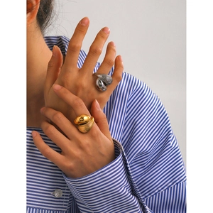 Minimalist 18k gold and silver stainless steel rings with sculptural water drop design