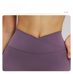 Detail of purple crossover high waist yoga shorts featuring elastic quick-dry fabric