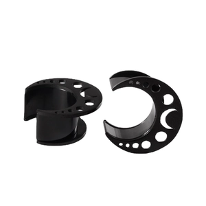 Black stainless steel moon-shaped ear gauges with hollow crescent design from two angles