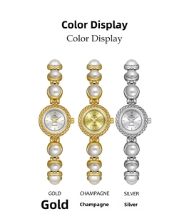 Close-up of pearl chain watches in gold, champagne and silver with quartz dials