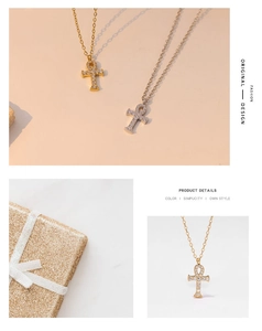 Detailed view of gold and silver Ankh pendants with zircons and gift box packaging