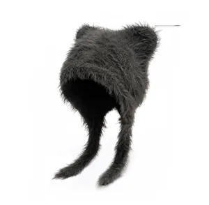 Close-up of thick grey plush earflap hat with cute animal ears and soft fuzzy texture