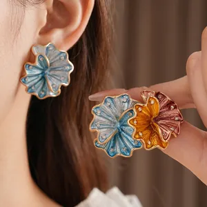 Vintage enamel flower earrings with crystal borders in blue, yellow and red brown