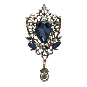 Vintage bronze brooch with dark blue waterdrop crystal and hollow filigree pendant