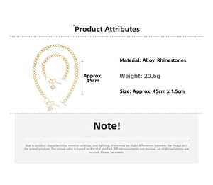 Detail of gold-tone alloy lock and key necklace set with rhinestone and size measurements