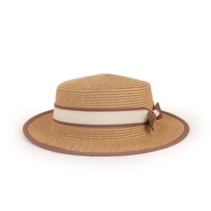 Detailed view of natural straw boater hat featuring a brown bow and woven texture