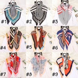 Detailed grid of satin square scarves in 9 different letter D and classic plaid patterns