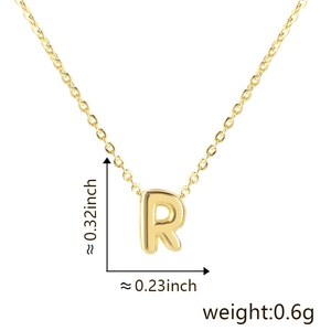 Detailed dimensions of gold letter R charm showing height 0.32 inch and weight 0.6g