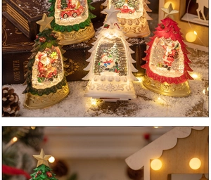Macro detail of glowing Christmas crystal ball tree with Santa and warm LED lights