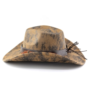 Detail of vintage brown cowboy hat with leather band and metal rivets on white background