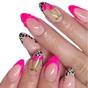 Long almond press-on nails with 3D cherry and leopard patterns in vibrant pink