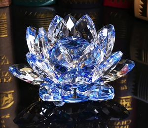 Detail view of blue crystal lotus ornament with multifaceted petals and light reflection