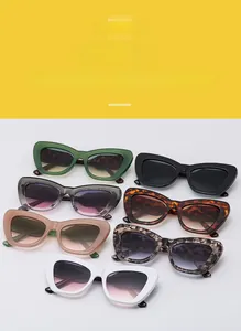 Detailed display of chunky cat eye sunglasses in seven colors including forest green and tortoiseshell