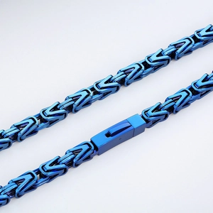 Detailed close-up of a blue Byzantine stainless steel chain with secure fold-over clasp