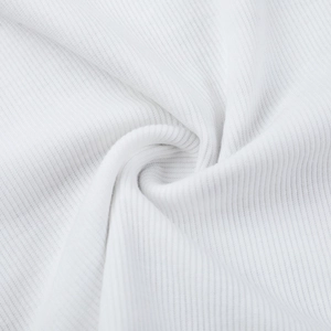 Close-up of white ribbed knit fabric showing soft vertical texture and premium material