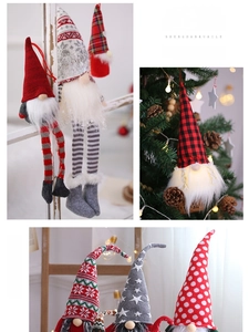 Detail of Christmas gnome plush ornaments with LED lights on a decorated tree