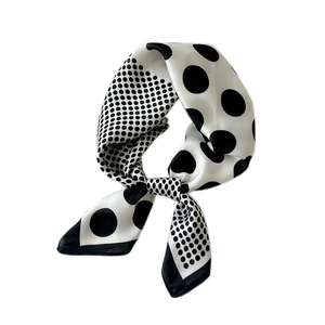 Polka dot square silk scarf for women featuring classic black and white satin fabric design