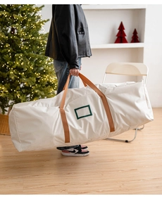 Close-up of beige Oxford cloth Christmas tree bag with reinforced handles and label slot