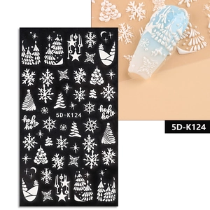Detailed view of 5D white embossed Christmas nail stickers with snowflake and Santa motifs