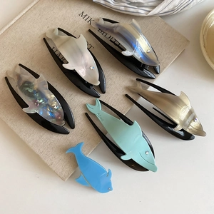 Detail view of colorful dolphin hair claws with pearl texture and AJ1013 model engraving