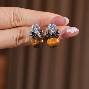 Bowknot earrings with heart zircon and tiger eye stone in retro vintage aesthetic